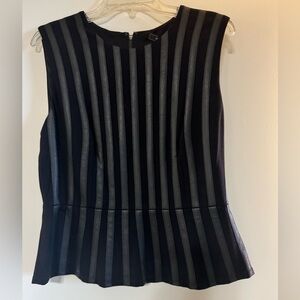 Black on black peplum top can be dressy or casual. Very cute.